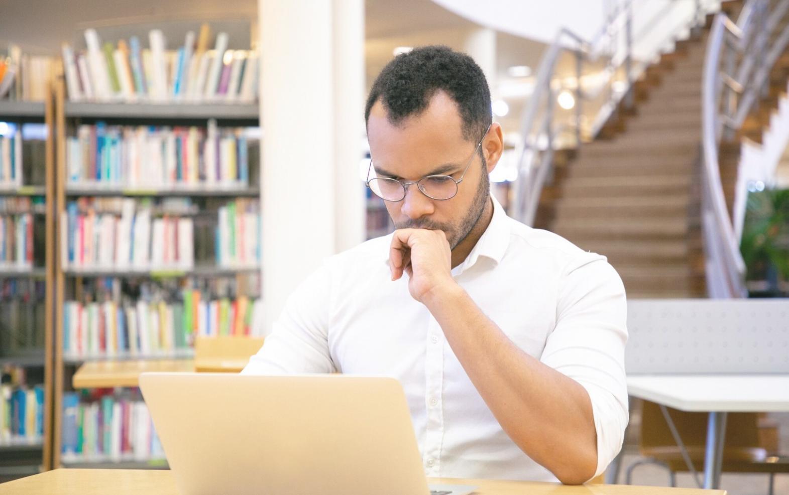 Professional reviewing financial reports with analytical tools